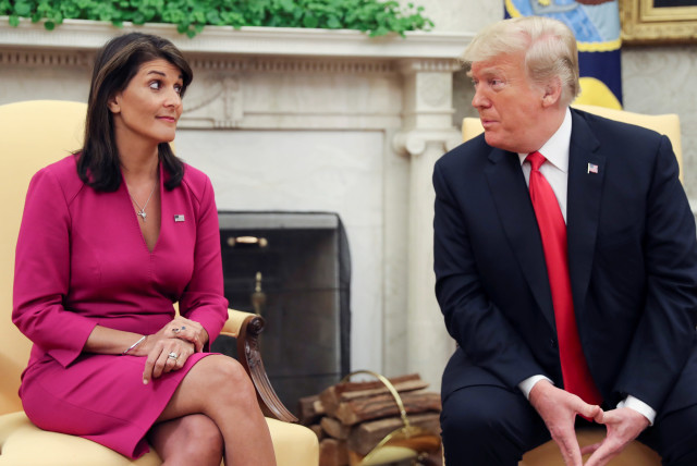 US President Donald Trump talks with UN Ambassador Nikki Haley in the Oval Office of the White House after it was announced the president had accepted the Haley's resignation in Washington, U.S., October 9, 2018 (credit: REUTERS/JONATHAN ERNST)