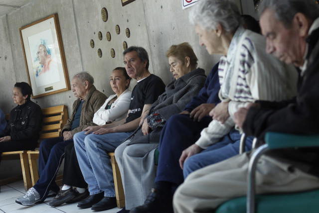  Patients with Alzheimer's and dementia are sit inside the Alzheimer foundation in Mexico City (credit: EDGARD GARRIDO/ REUTERS)
