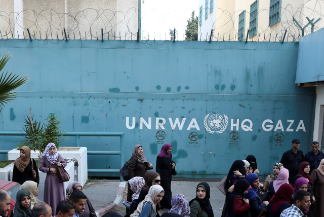 Palestinian employees of United Nations Relief and Works Agency (UNRWA) take part in a protest against job cuts by UNRWA, in Gaza City September 19, 2018.  (credit: REUTERS/IBRAHEEM ABU MUSTAFA)