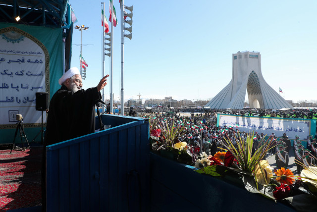 Iranian President Hassan Rouhani salutes the crowd during the commemoration of the 41st anniversary of the Islamic revolution in Tehran, Iran February 11, 2020 (credit: OFFICIAL PRESIDENT WEBSITE/HANDOUT VIA REUTERS)