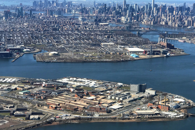 The Rikers Island Prison complex is seen from an airplane in the Queens borough of New York City, New York (credit: REUTERS)
