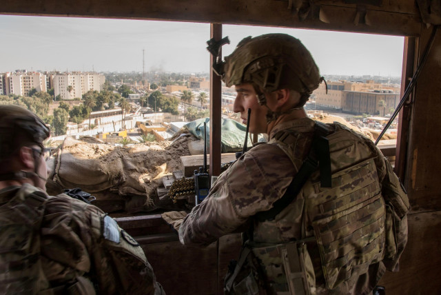 US Army soldiers keep watch on the US embassy compound in Baghdad, Iraq January 1, 2020 (credit: DOD/LT. COL. ADRIAN WEALE/HANDOUT VIA REUTERS)