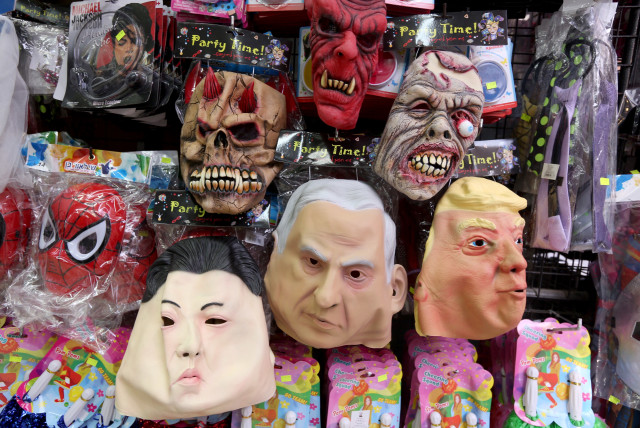 A BRILLIANT future: Purim masks on sale at Jerusalem’s Mahaneh Yehuda marke (credit: MARC ISRAEL SELLEM)