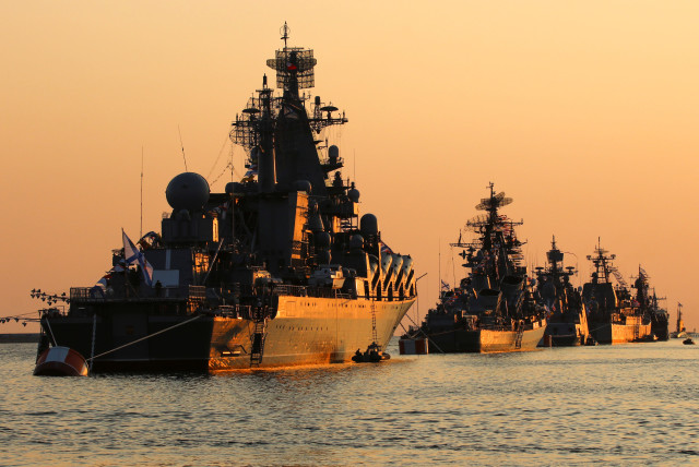 A view shows Russian warships on sunset ahead of the Navy Day parade in the Black Sea port of Sevastopol, Crimea July 27, 2019 (credit: REUTERS/ALEXEY PAVLISHAK)
