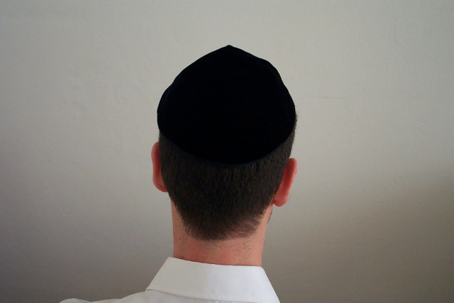 A man wears a black kippah. (credit: Wikimedia Commons)