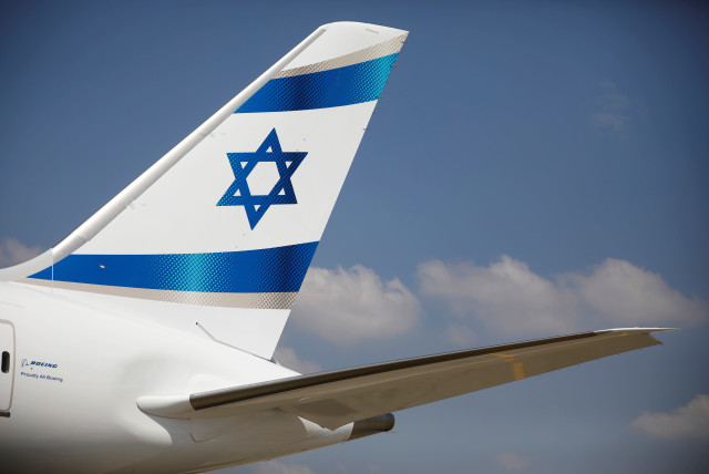 An Israeli flag is seen on the first of Israel's El Al Airlines order of 16 Boeing 787-9 Dreamliner jets, as it lands at Ben Gurion International Airport, near Tel Aviv (credit: REUTERS/AMIR COHEN)