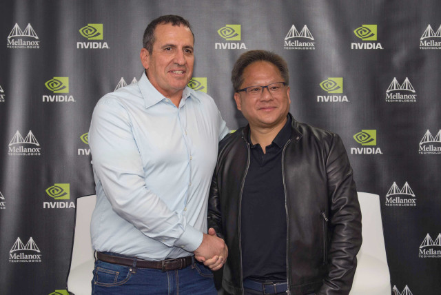 Mellanox founder and CEO Eyal Waldman (left) with Nvidia founder and CEO Jensen Huang in March 2019 (credit: OMER TAL)