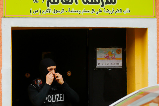  German special police leaves the El-Irschad (Al-Iraschad e.V.) centre in Berlin, Germany, April 30, 2020, after Germany has banned Iran-backed Hezbollah on its soil and designated it a terrorist organisation (credit: REUTERS/HANNIBAL HANSCHKE)