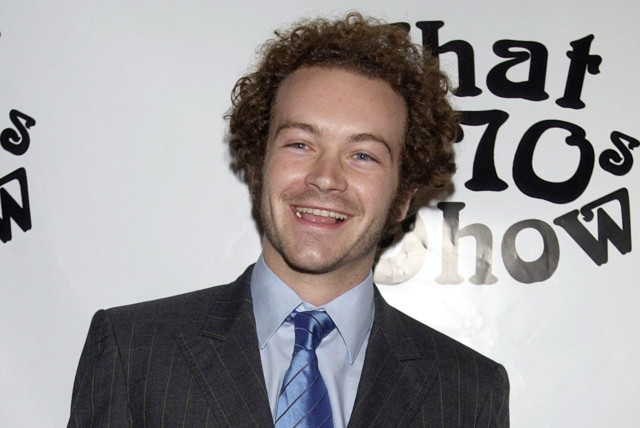 Cast member Danny Masterson poses for photographers during a celebration of ''That '70s Show'' 100th episode, in Los Angeles April 10, 2002. (credit: REUTERS)