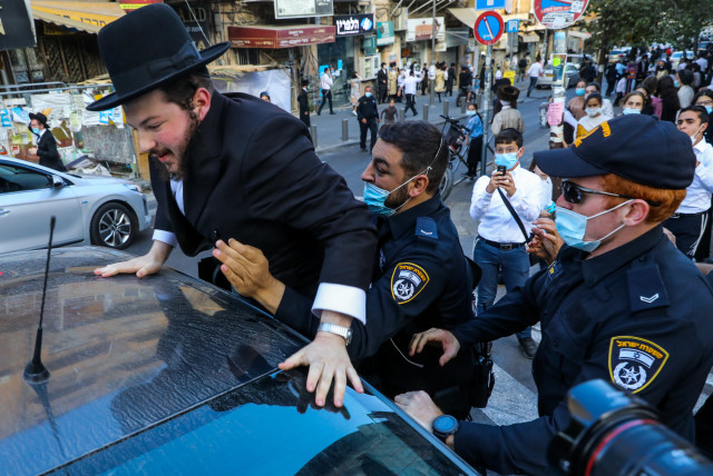 POLICE IN Jerusalem detain a haredi protester last week. (credit: MARC ISRAEL SELLEM/THE JERUSALEM POST)