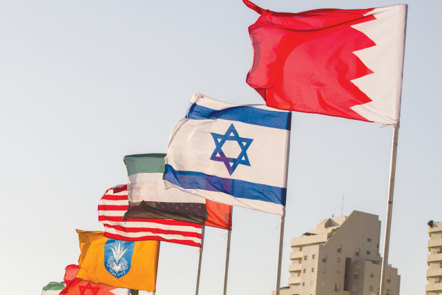 THE FLAGS of the US, United Arab Emirates, Israel and Bahrain are seen on the side of a road in Netanya, in September. (credit: FLASH90)