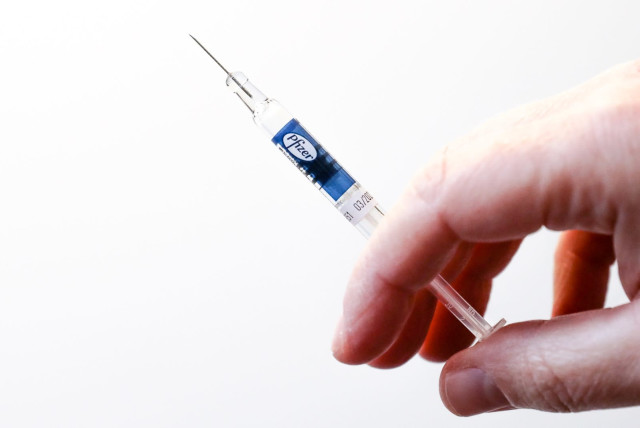 An illustrative photo of the Pfizer COVID-19 vaccine. (photo credit: MARC ISRAEL SELLEM/THE JERUSALEM POST)