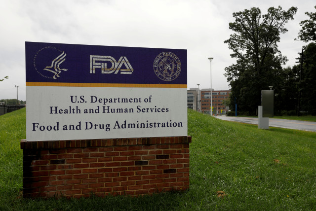 Signage is seen outside of FDA headquarters in White Oak, Maryland. (credit: REUTERS)