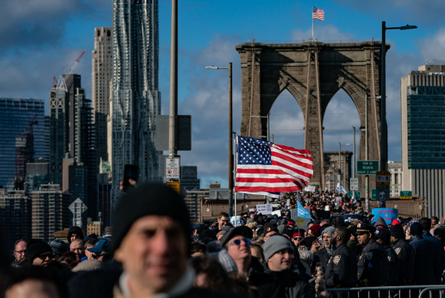 Participants in a Jewish solidarity march across New York City's Brooklyn Bridge, Jan. 5, 2020. The march in the city was held in response to a recent rise in anti-Semitic crimes in the New York metropolitan area. (Jeenah Moon/Getty Images) (photo credit: JEENAH MOON)