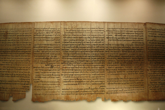 A facsimile of the Isaiah Scroll, one of the Dead Sea Scrolls, is displayed inside the Shrine of the Book at the Israel Museum in Jerusalem September 26, 2011. Developed in partnership with Google, the Israel Museum on Monday launched its Dead Sea Scrolls Digital Project, allowing users to explore t (credit: BAZ RATNER/REUTERS)