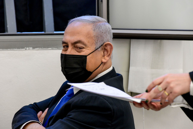 Israeli prime minister Benjamin Netanyahu seen as he arrives for a court hearing at the District Court in Jerusalem on February 8, 2021, PM Netanyahu is on trial on criminal allegations of bribery, fraud and breach of trust. (credit: REUVEN KASTRO/POOL)