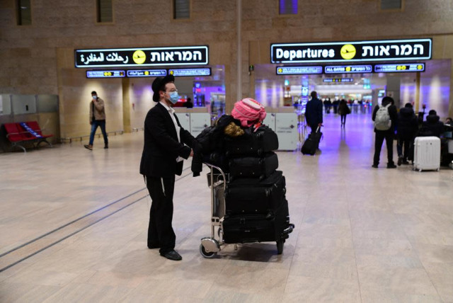 Passengers in Ben-Gurion Airport amid ongoing coronavirus restrictions, Feb. 2021 (credit: AVSHALOM SASSONI/ MAARIV)
