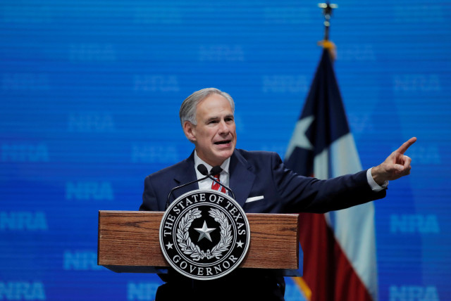 Texas Governor Greg Abbott speaks at the annual National Rifle Association (NRA) convention in Dallas, Texas, May 4, 2018 (credit: REUTERS/LUCAS JACKSON/FILE PHOTO)