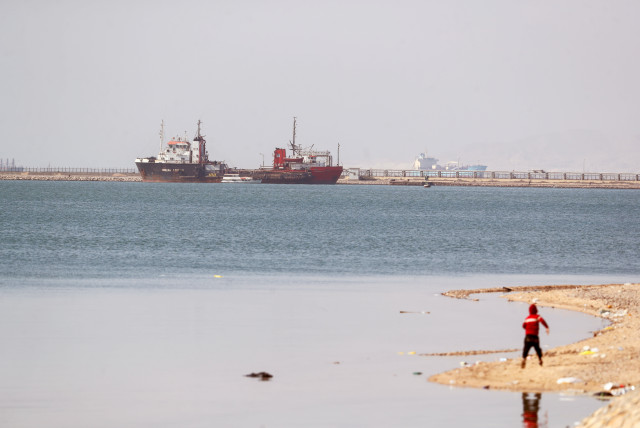 Ships are seen at the entrance of the Suez Canal, Egypt March 26, 2021. (credit: MOHAMED ABD EL GHANY/REUTERS)