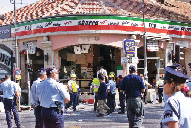 A GAPING hole is left in the shop front of the Sbarro pizzeria in Jerusalem after the suicide bombing that killed 15 people and wounded more than 80 others. (credit: REUTERS)