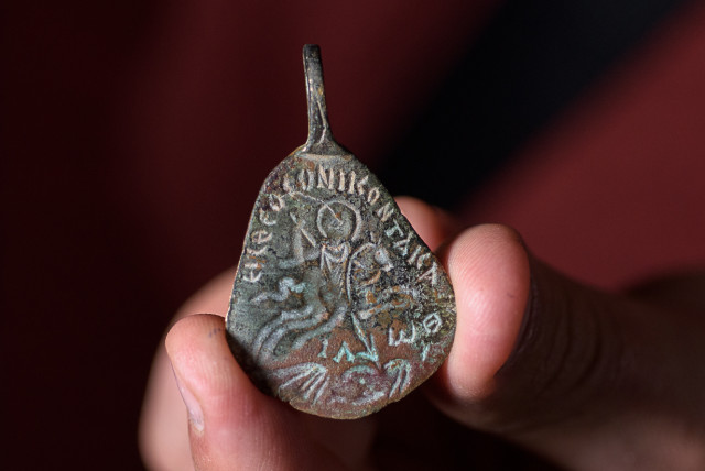 Ancient amulet to protect against the 'evil eye.' (credit: DAFNA GAZIT/ISRAEL ANTIQUITIES AUTHORITY)