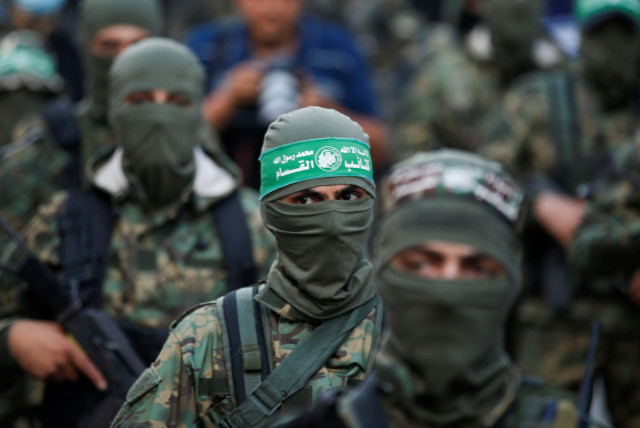 Palestinian Hamas militants take part in an anti-Israel rally in Gaza City May 22, 2021 (photo credit: REUTERS/MOHAMMED SALEM)
