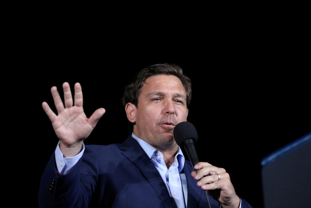 Florida Governor Ron Desantis speaks during a campaign rally by then US president Donald Trump at Pensacola International Airport in Pensacola, Florida, US, October 23, 2020. (photo credit: TOM BRENNER/REUTERS)