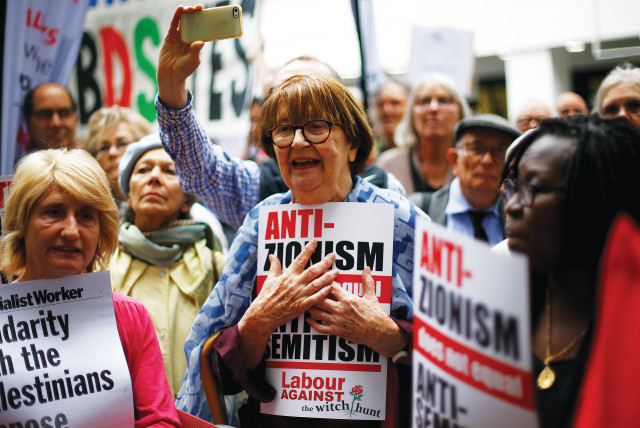 SUPPORTERS OF Britain’s Labour Party take part in protests outside a meeting of its National Executive, which was discussing the party’s definition of antisemitism, in London in 2018 (credit: HENRY NICHOLLS/REUTERS)