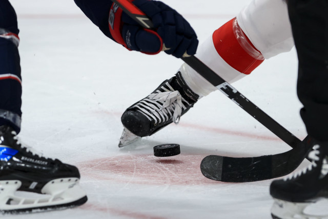 May 8, 2021; Columbus, Ohio, USA; A view of the official NHL puck on the ice during a face-off between a member of the Columbus Blue Jackets and the Detroit Red Wings in the third period at Nationwide Arena.  (credit: AARON DOSTER-USA TODAY SPORTS)
