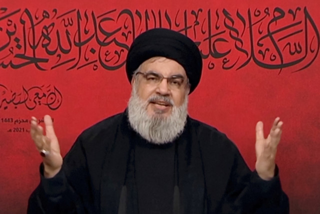  Lebanon's Hezbollah leader Sayyed Hassan Nasrallah speaks through a screen during a religious ceremony marking Ashura (credit: AL-MANAR/HANDOUT VIA REUTERS)