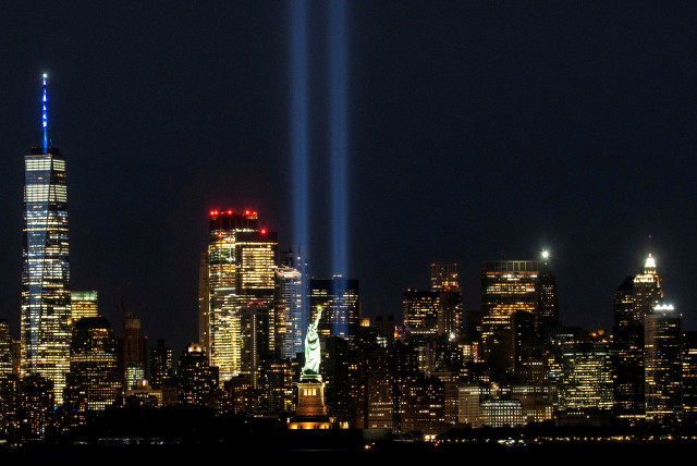  The Statue of Liberty and One World Trade Center are seen as the Tribute in Light shines in downtown Manhattan to commemorate the 19th anniversary of the September 11, 2001 attacks on the World Trade Center at the 9/11 Memorial & Museum in the Manhattan borough of New York City, New York, US, Sep (credit: REUTERS)