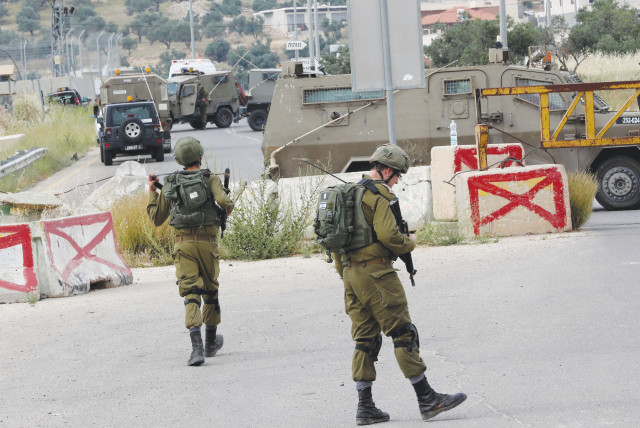  SOLDIERS ON patrol in the Hebron Hills area.  (credit: WISAM HASHLAMOUN/FLASH90)