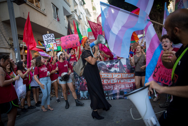  Members of the LGBTQ+ community and supporters participate in a protest march in support of the transgender community, in Tel Aviv on July 22, 2018. (credit: MIRIAM ALSTER/FLASH90)