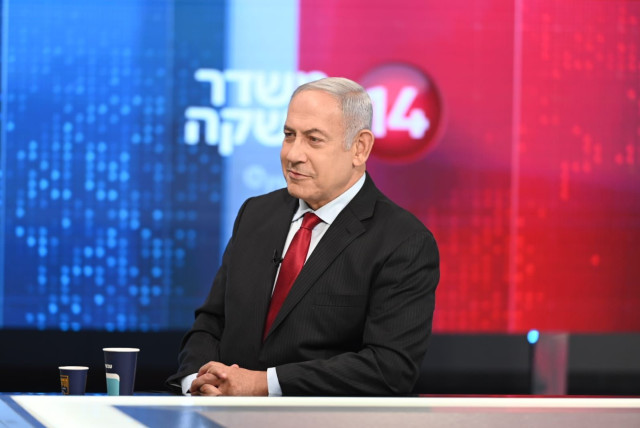  Opposition head Benjamin Netanyahu at the opening broadcast of Channel 14, November 27, 2021. (credit: MEIR ELIPOUR)
