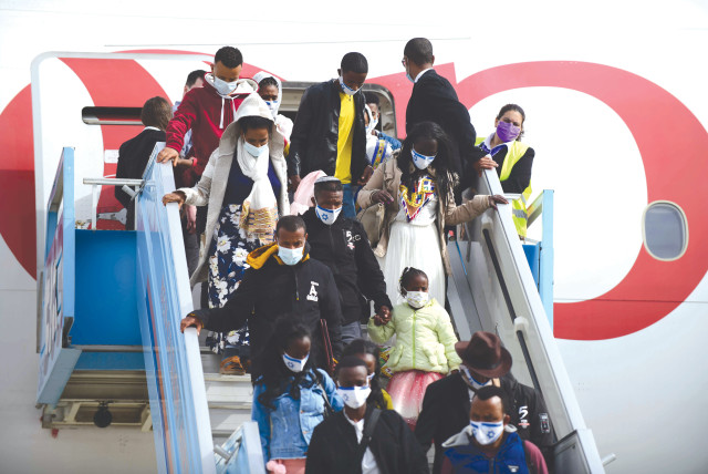  ETHIOPIANS ARRIVE on aliyah at Ben-Gurion Airport earlier this year. Ethiopian aliyah constitutes a crucial moral issue for the Jewish people. (credit: TOMER NEUBERG/FLASH90)