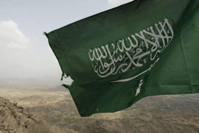  Saudi Arabia's national flag is seen at the Khoba frontline border with Yemen (credit: REUTERS/FAHAD SHADEED)