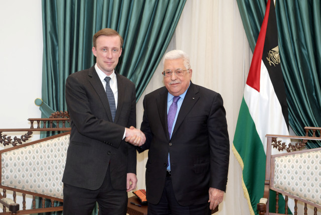  Palestinian President Mahmoud Abbas shakes hands with US National Security Advisor Jake Sullivan in Ramallah, in the West Bank, December 22, 2021. (credit: PALESTINIAN PRESIDENT OFFICE (PPO)/HANDOUT VIA REUTERS)