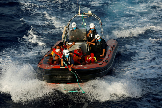  A RHIB (rigid hulled inflatable boat) from the German NGO migrant rescue ship Sea-Watch 3 returns to the ship after rescuing twelve migrants from a wooden boat in international waters north of Libya, in the western Mediterranean Sea, August 2, 2021. (credit: DARRIN ZAMMIT LUPI/REUTERS)
