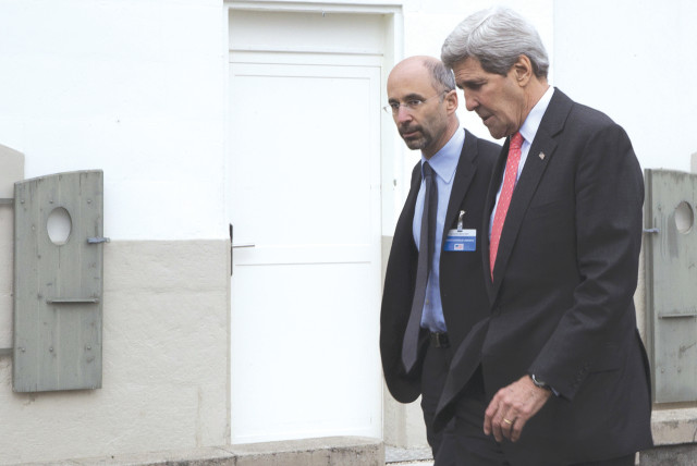  THEN-US secretary of state John Kerry walks with Robert Malley following a meeting with an Iranian team in 2015, before the Iran nuclear deal was reached.  (credit: BRIAN SNYDER/REUTERS)