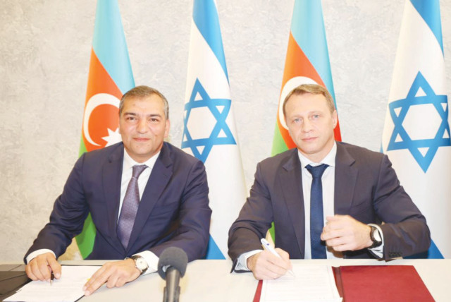  FUAD NAGHIYEV (left), chairman of the State Tourism Agency of the Republic of Azerbaijan, and Tourism Minister Yoel Razvozov at the signing ceremony for the Azerbaijan Tourist Office in Israel.  (credit: RAFI DELOYA)