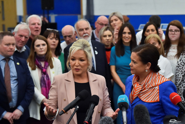 Sinn Fein deputy leader Michelle O'Neill speaks to the media next to party leader Mary Louise McDonald, at the Meadowbank Sports Arena count centre, in Magherafelt, Northern Ireland, May 7, 2022. (credit: REUTERS/CLODAGH KILCOYNE)