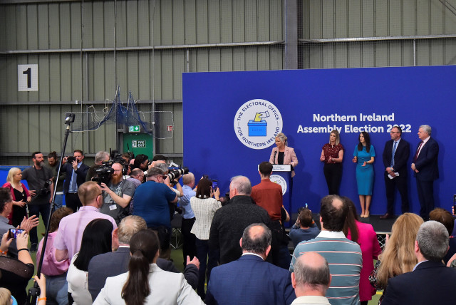 Sinn Fein deputy leader Michelle O'Neill speaks on stage, after Sinn Fein were voted as the largest party in Northern Ireland, at the Meadowbank Sports Arena count centre, in Magherafelt, Northern Ireland, May 7, 2022. (credit: REUTERS/CLODAGH KILCOYNE)