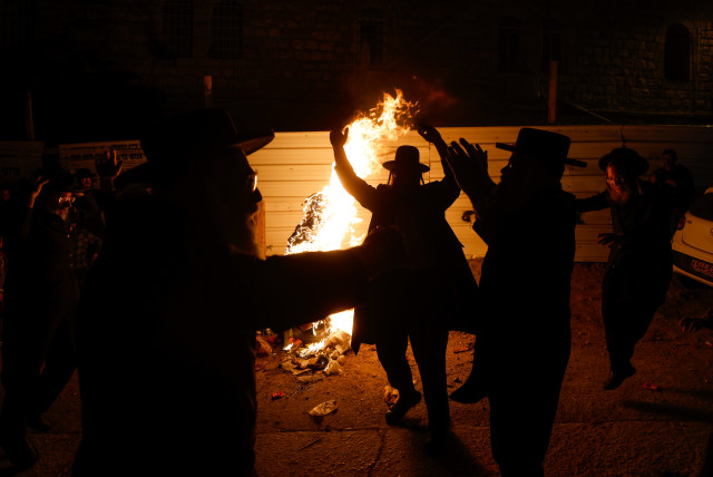  Ultra orthodox Jews celebrate the Jewish holiday of Lag Ba'omer, in ultra-orthodox neighborhood of Mea Shearim, in Jerusalem, on May 18, 2022. (credit: OLIVIER FITOUSSI/FLASH90)