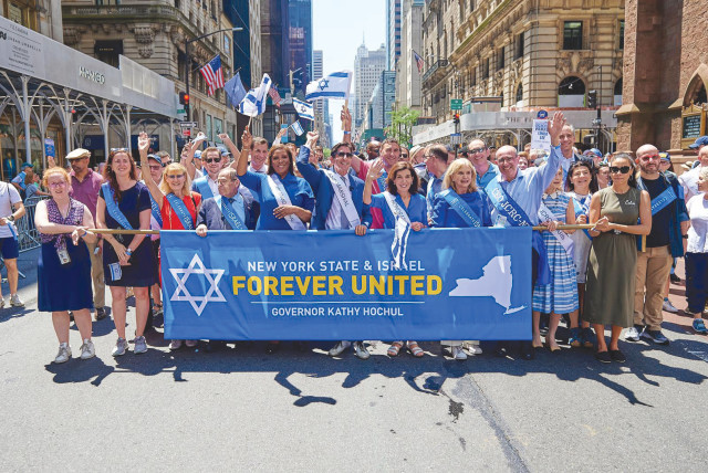 PARTICIPANTS AT the Celebrate Israel Parade include the author, the grand marshal of the event, at the front and center flanked by the governor of the State of New York Kathy Hochul to the immediate right and state Attorney-General Letitia James to the immediate left.  (credit: PERRY BINDELGLASS)