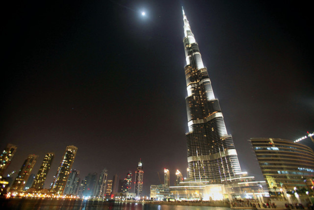  The Burj Khalifa lit up at night (credit: MOHAMMED SALEM/REUTERS)