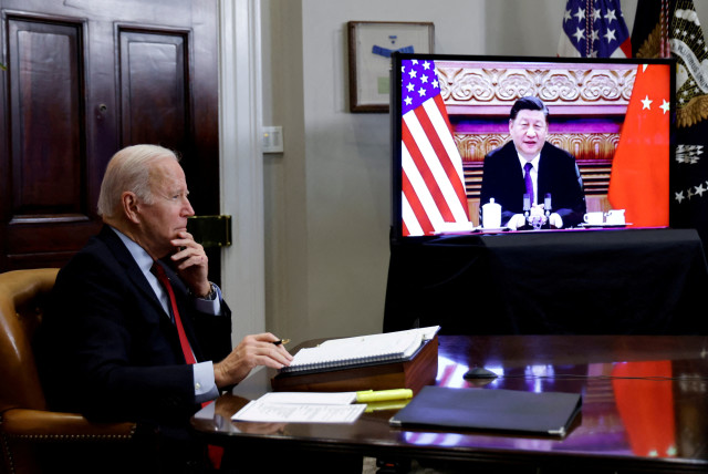   US President Joe Biden speaks virtually with Chinese leader Xi Jinping from the White House in Washington, US November 15, 2021. (credit: REUTERS)