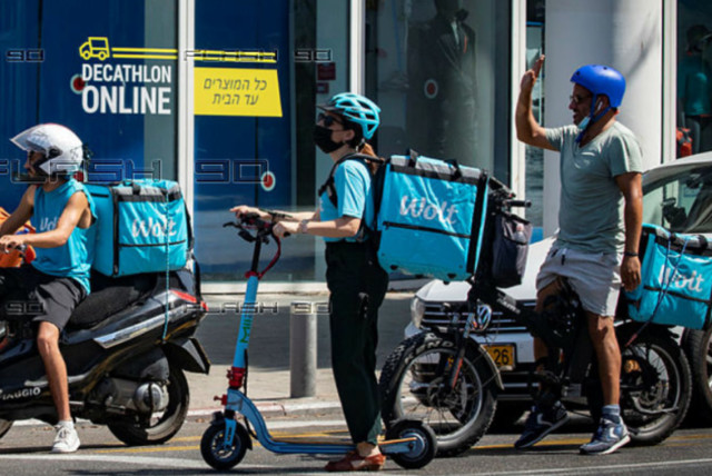  WOLT FOOD delivery drivers in Tel Aviv.  (credit: MIRIAM ALSTER/FLASH90)