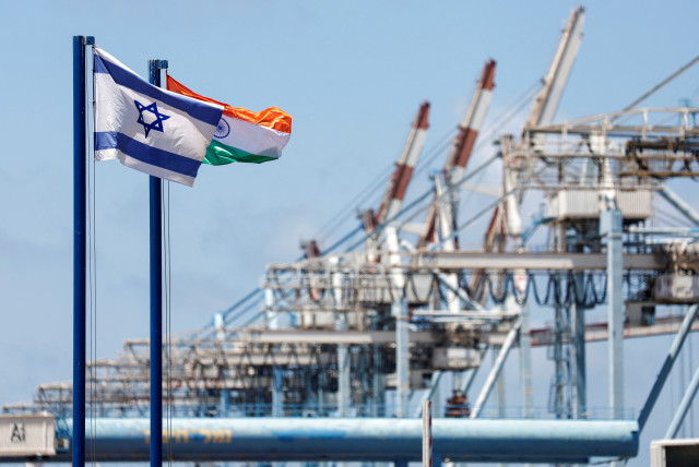  Israeli and Indian national flags fly at Haifa Port, which is to be sold to India's Adani Ports and local partner Gadot, in Haifa, Israel July 24, 2022. (credit: REUTERS/AMIR COHEN)