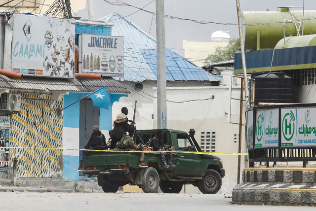 Somali security officers are seen at a section of Hotel Hayat, the scene of an al Qaeda-linked al Shabaab group militant attack in Mogadishu, Somalia August 20, 2022. (credit: REUTERS/FEISAL OMAR)