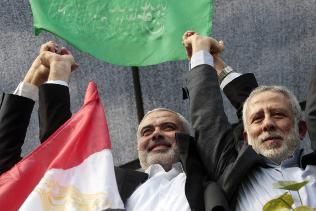  Senior Hamas leader Ismail Haniyeh (L) and Islamic Jihad leader Mohammed Al-Hindi (credit: REUTERS/AHMED ZAKOT)